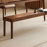 Minimalist walnut wood bench in modern dining room